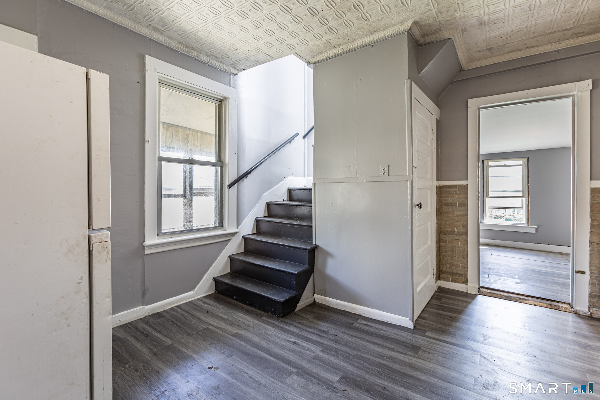 17 Hawthorne Terrace Torrington, CT 06790 - Photo 14 of 37 a view of front door with wooden floor and stairs