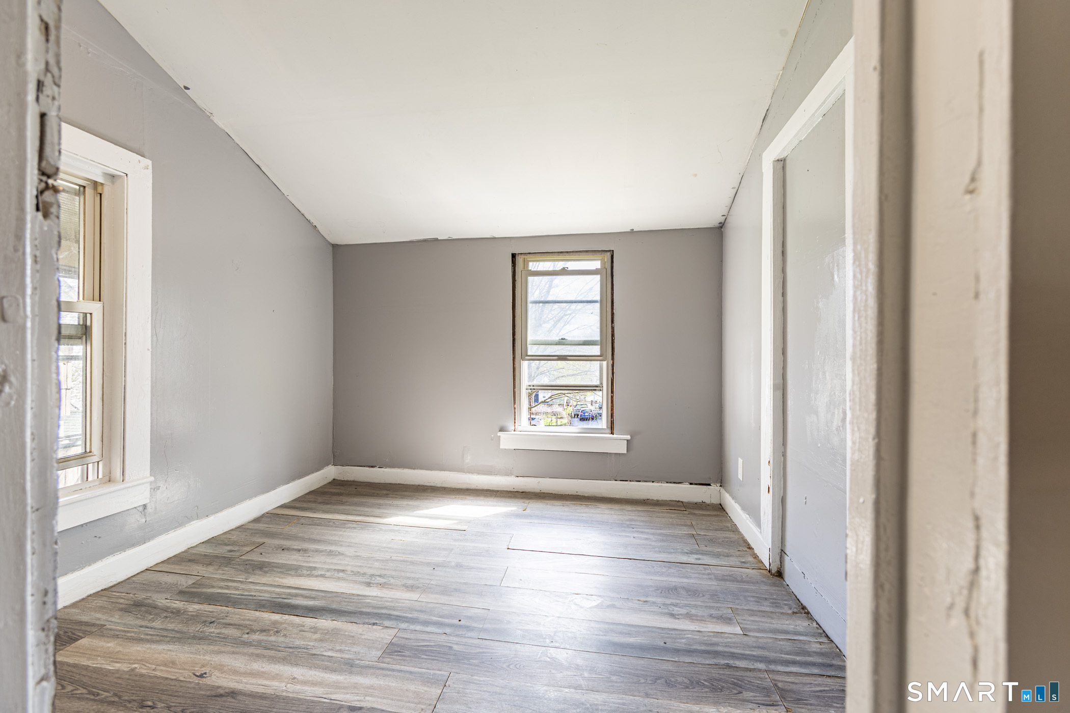 17 Hawthorne Terrace Torrington, CT 06790 - Photo 15 of 37 a view of an empty room with wooden floor and a window