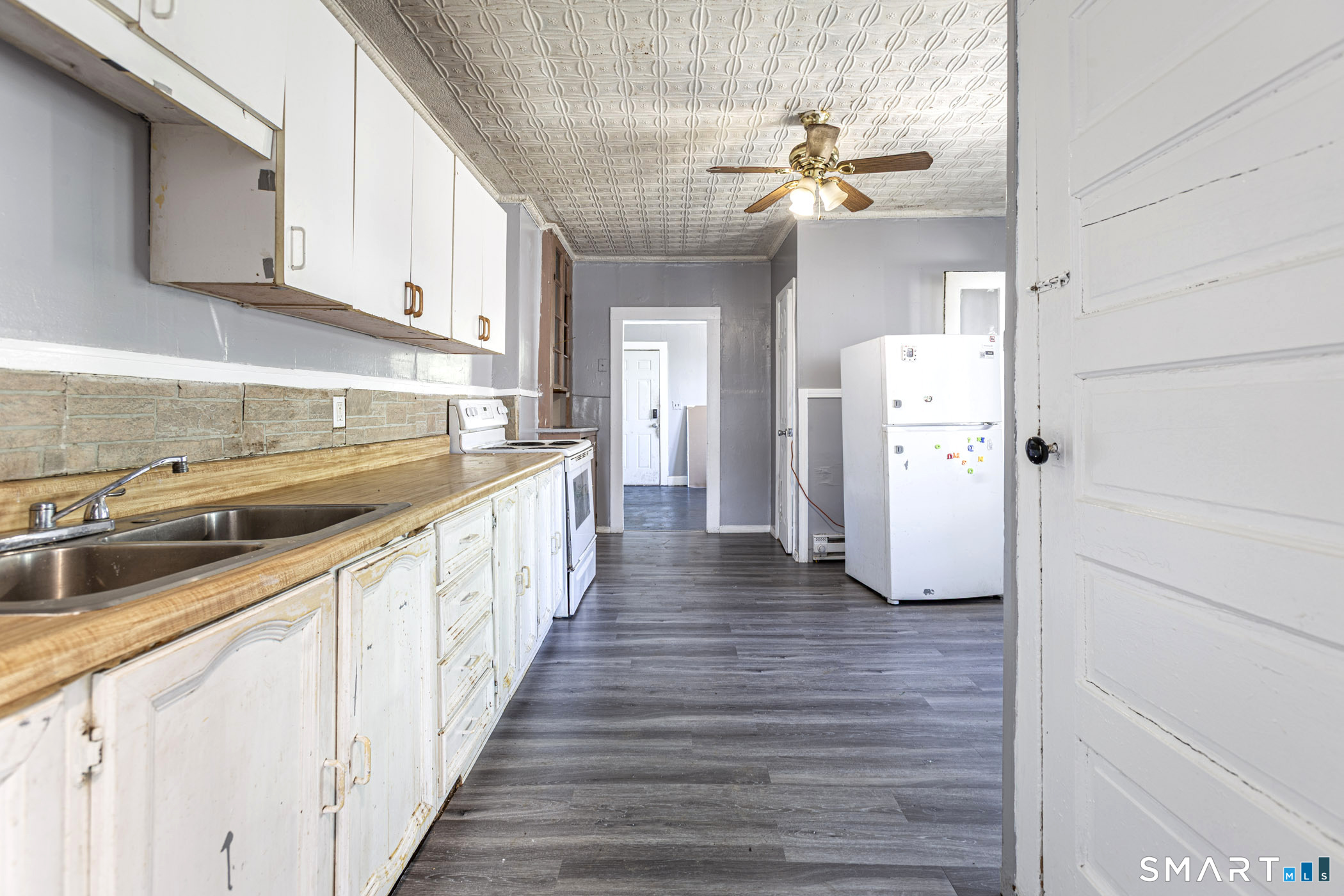 17 Hawthorne Terrace Torrington, CT 06790 - Photo 17 of 37 a kitchen with a refrigerator and a sink
