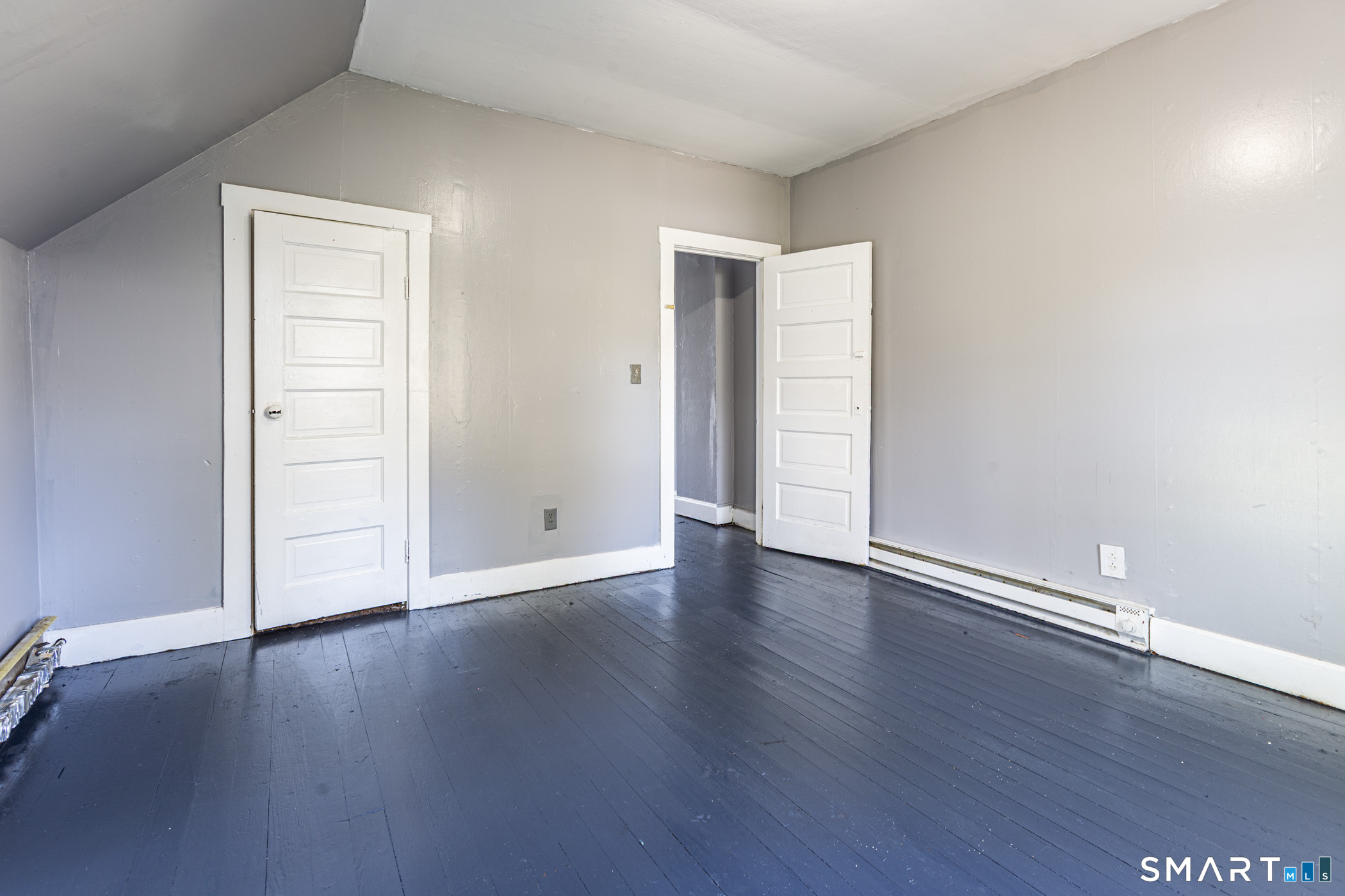 17 Hawthorne Terrace Torrington, CT 06790 - Photo 23 of 37 a view of an empty room with wooden floor and a window