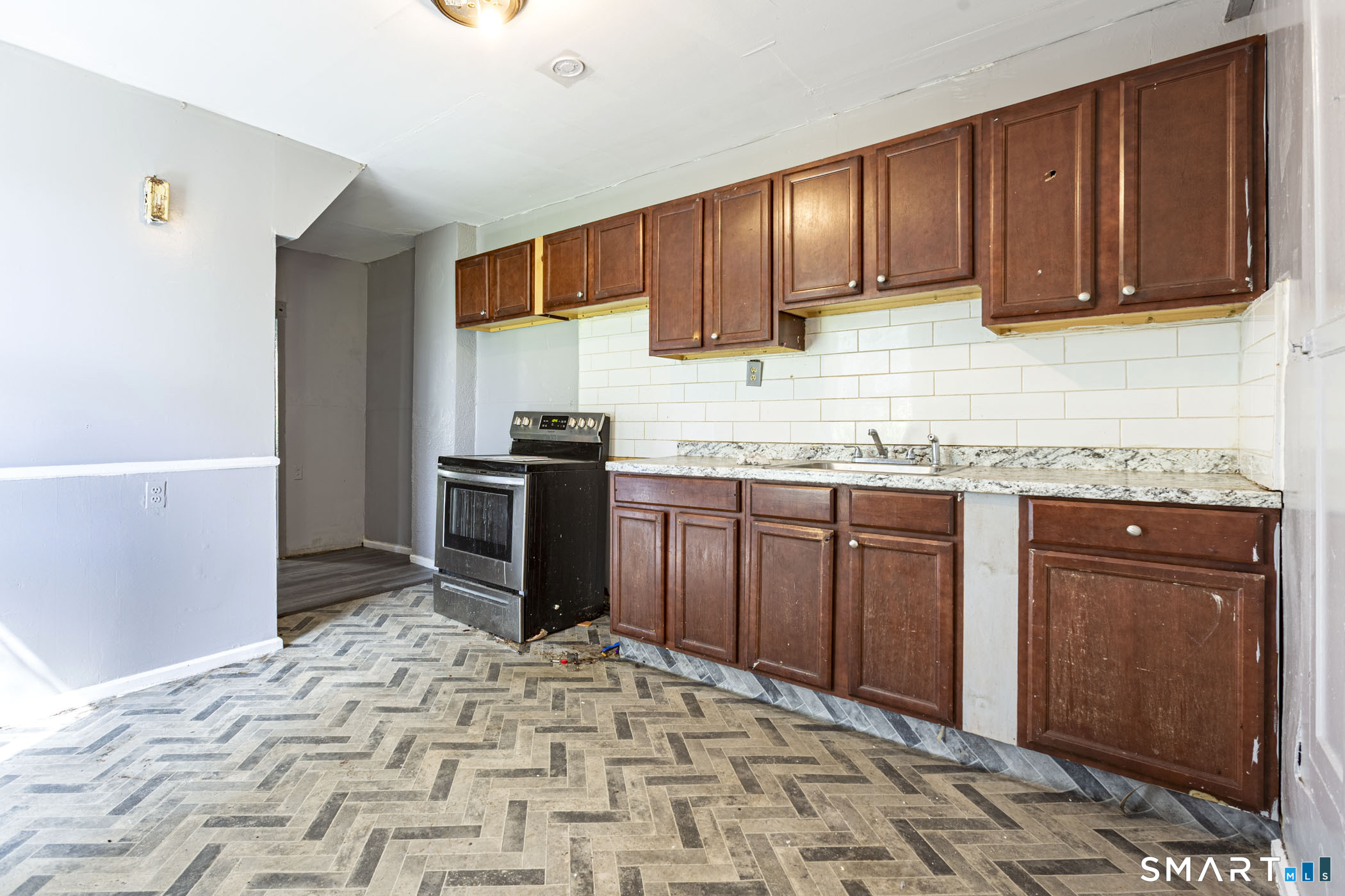 17 Hawthorne Terrace Torrington, CT 06790 - Photo 24 of 37 a kitchen with stainless steel appliances granite countertop a sink stove and cabinets