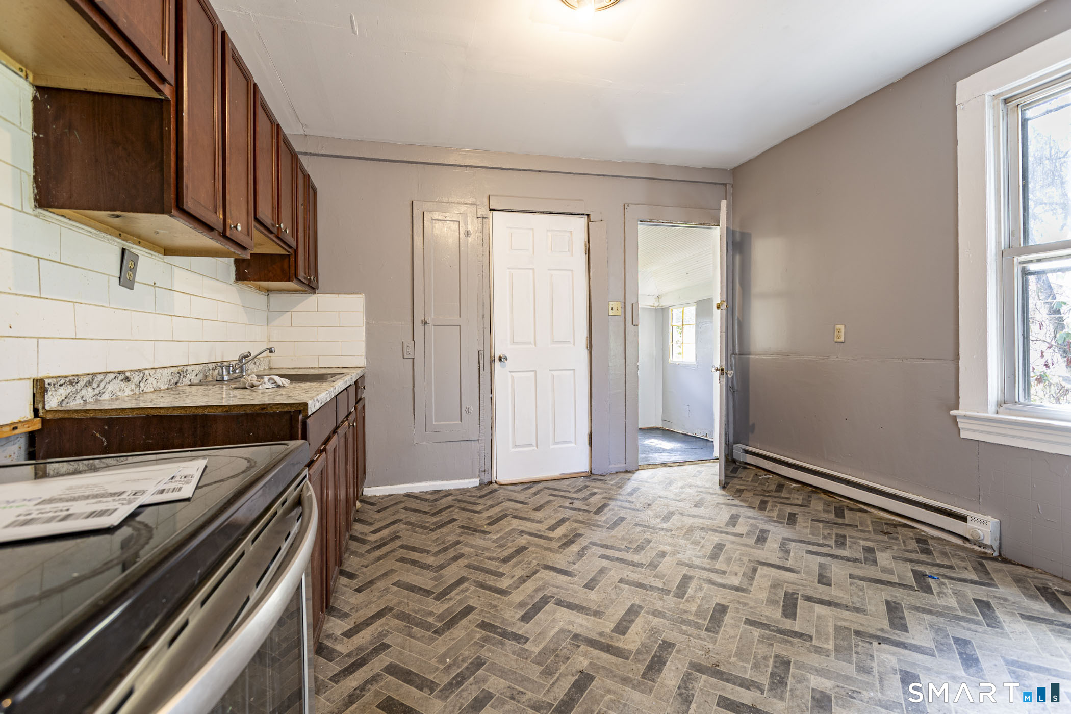 17 Hawthorne Terrace Torrington, CT 06790 - Photo 26 of 37 a kitchen with a stove and a microwave