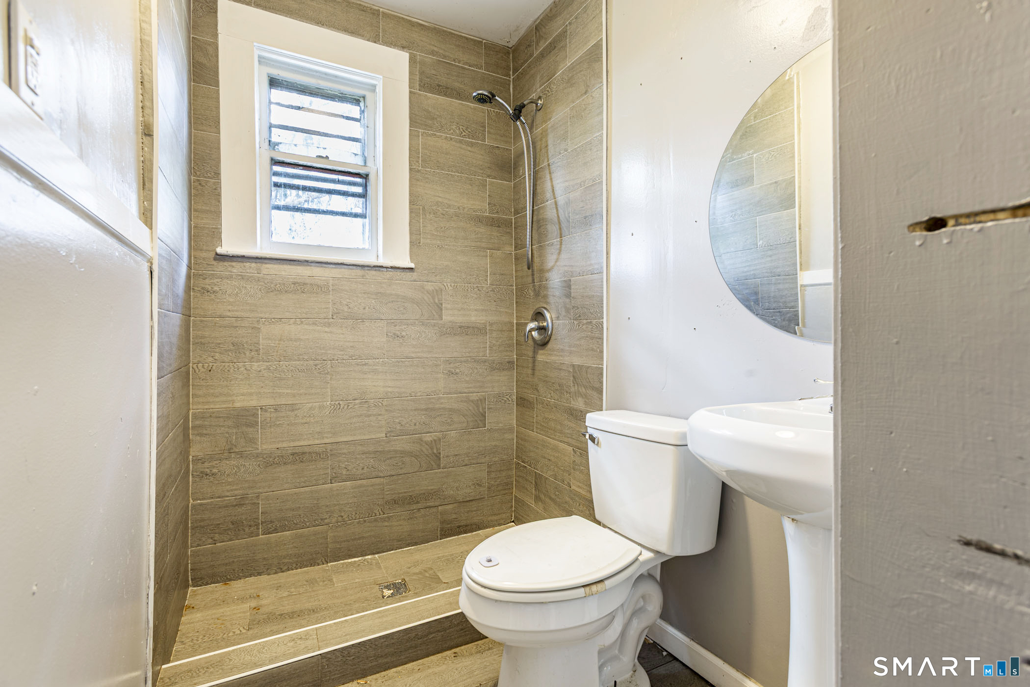 17 Hawthorne Terrace Torrington, CT 06790 - Photo 31 of 37 a bathroom with a toilet and a shower