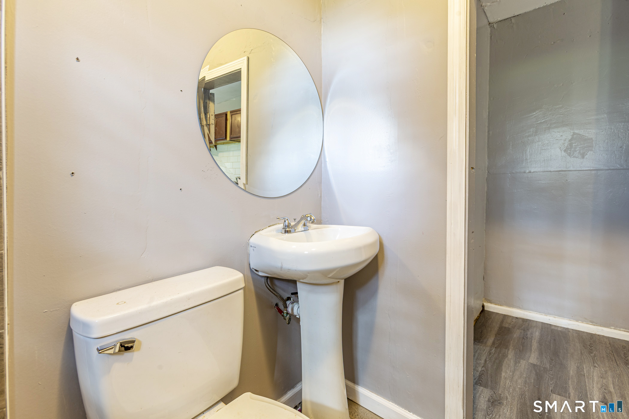 17 Hawthorne Terrace Torrington, CT 06790 - Photo 32 of 37 a bathroom with a toilet a sink and a mirror