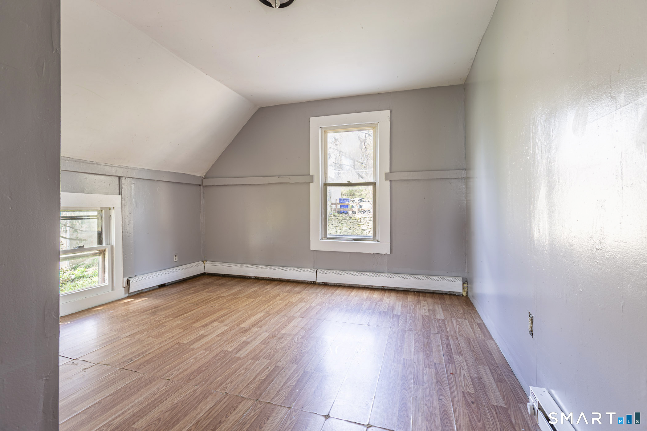 17 Hawthorne Terrace Torrington, CT 06790 - Photo 33 of 37 an empty room with wooden floor and windows