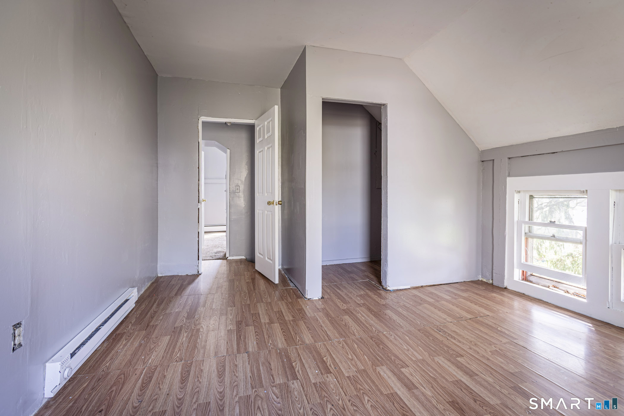 17 Hawthorne Terrace Torrington, CT 06790 - Photo 34 of 37 a view of an empty room with window and wooden floor