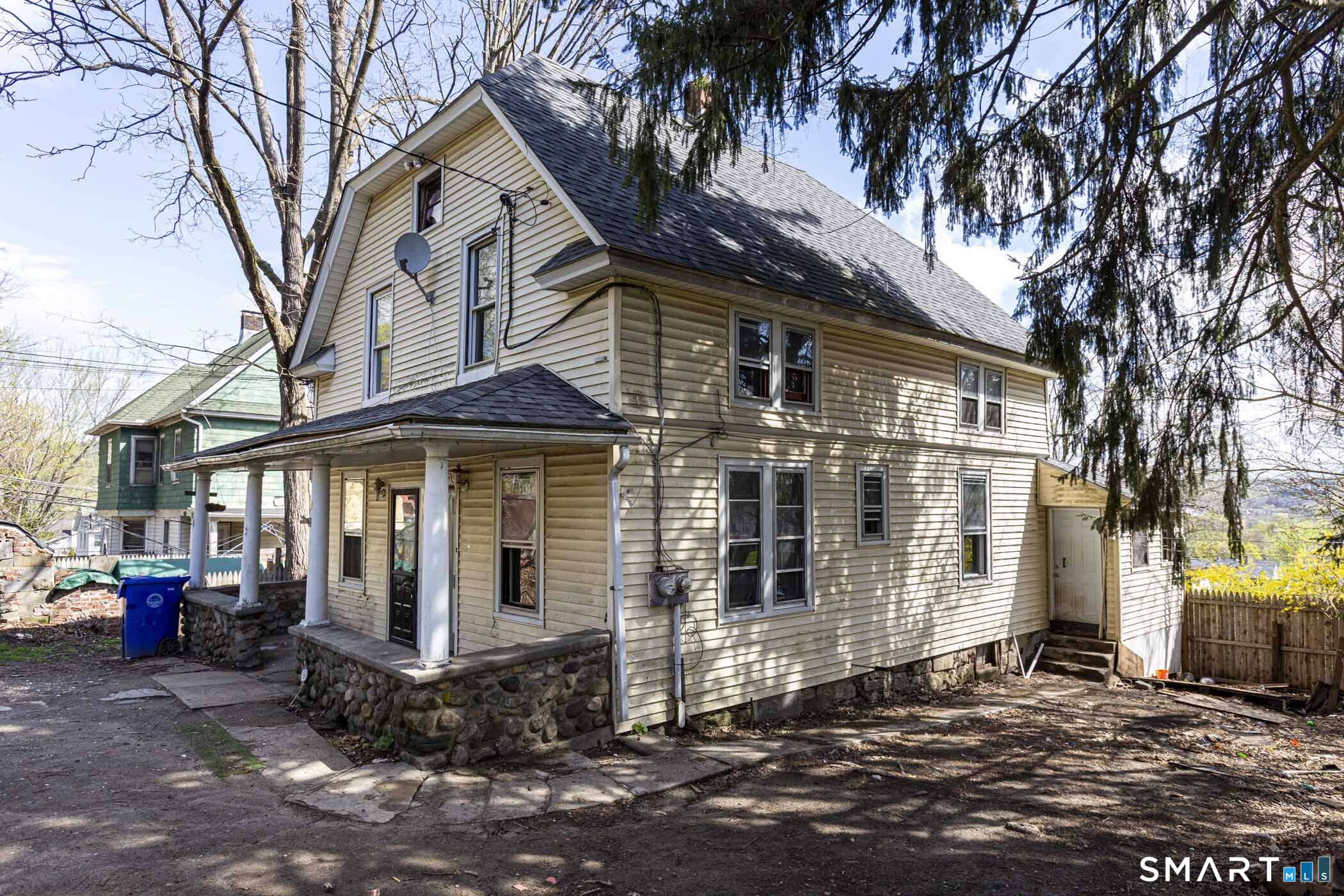 17 Hawthorne Terrace Torrington, CT 06790 - Photo 37 of 37 a front view of a house with a tree in front