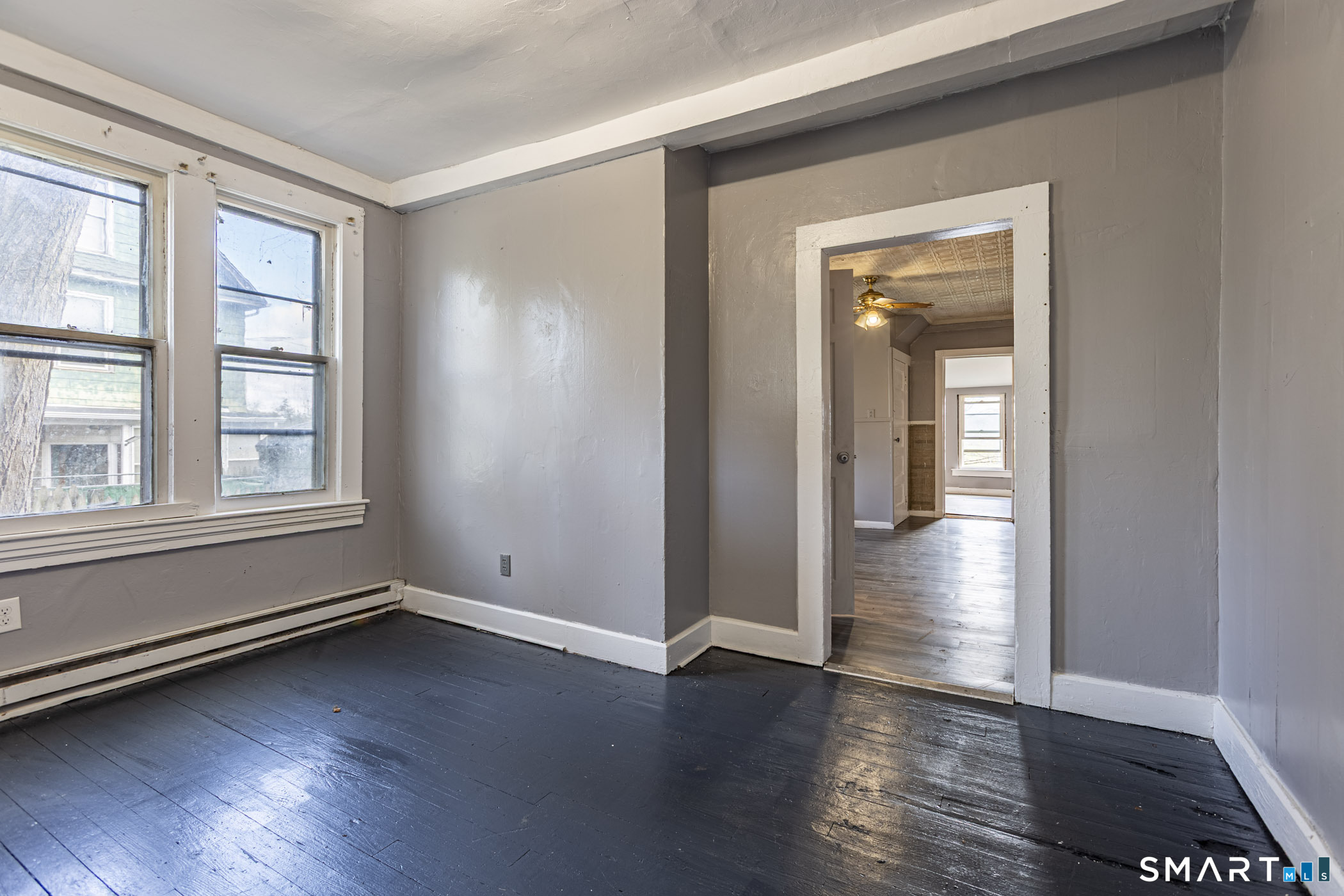 17 Hawthorne Terrace Torrington, CT 06790 - Photo 4 of 37 an empty room with wooden floor and windows
