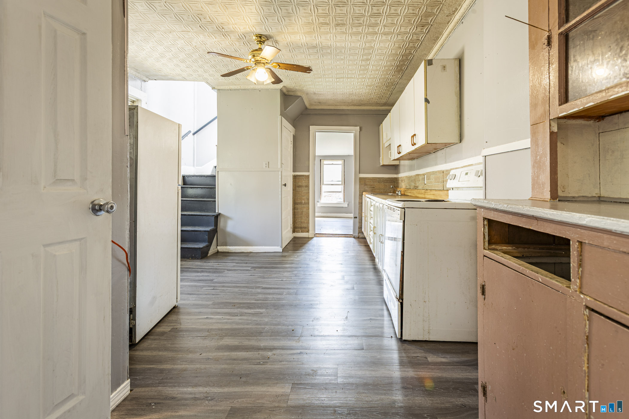 17 Hawthorne Terrace Torrington, CT 06790 - Photo 7 of 37 a view of a hallway with wooden floor and staircase
