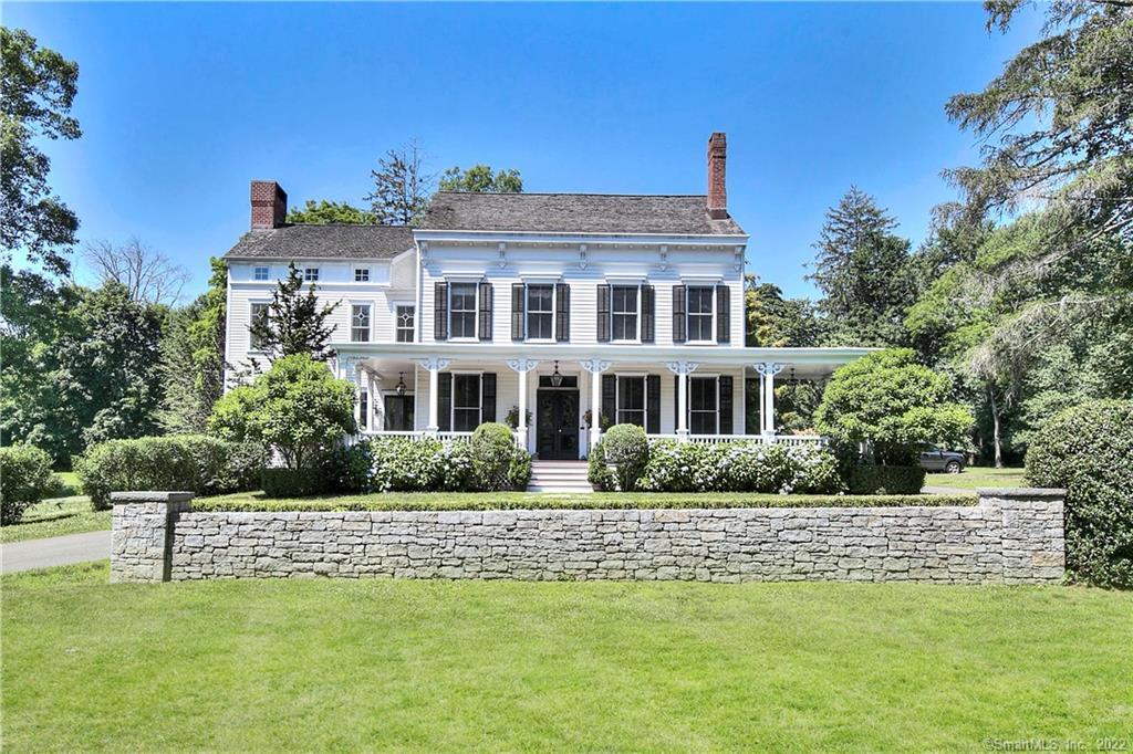 2347 Bronson Road Fairfield, CT 06824 - Photo 1 of 1 a front view of a house with a yard