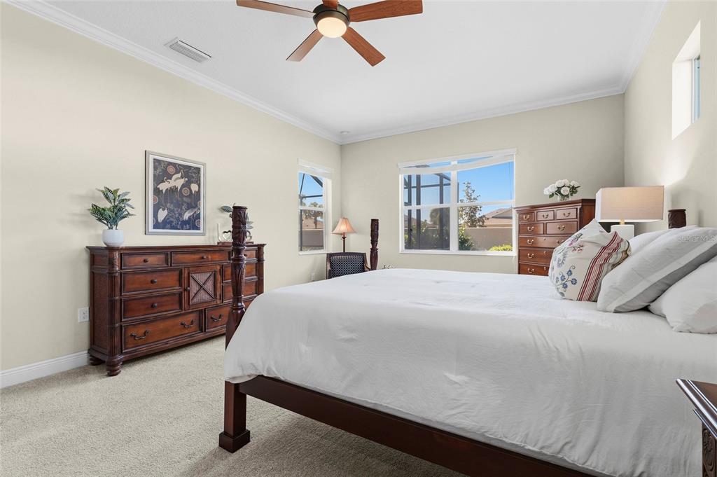 357 Marsh Creek Road Venice, FL 34292 - Photo 26 of 70 a bedroom with a bed and a dresser in it