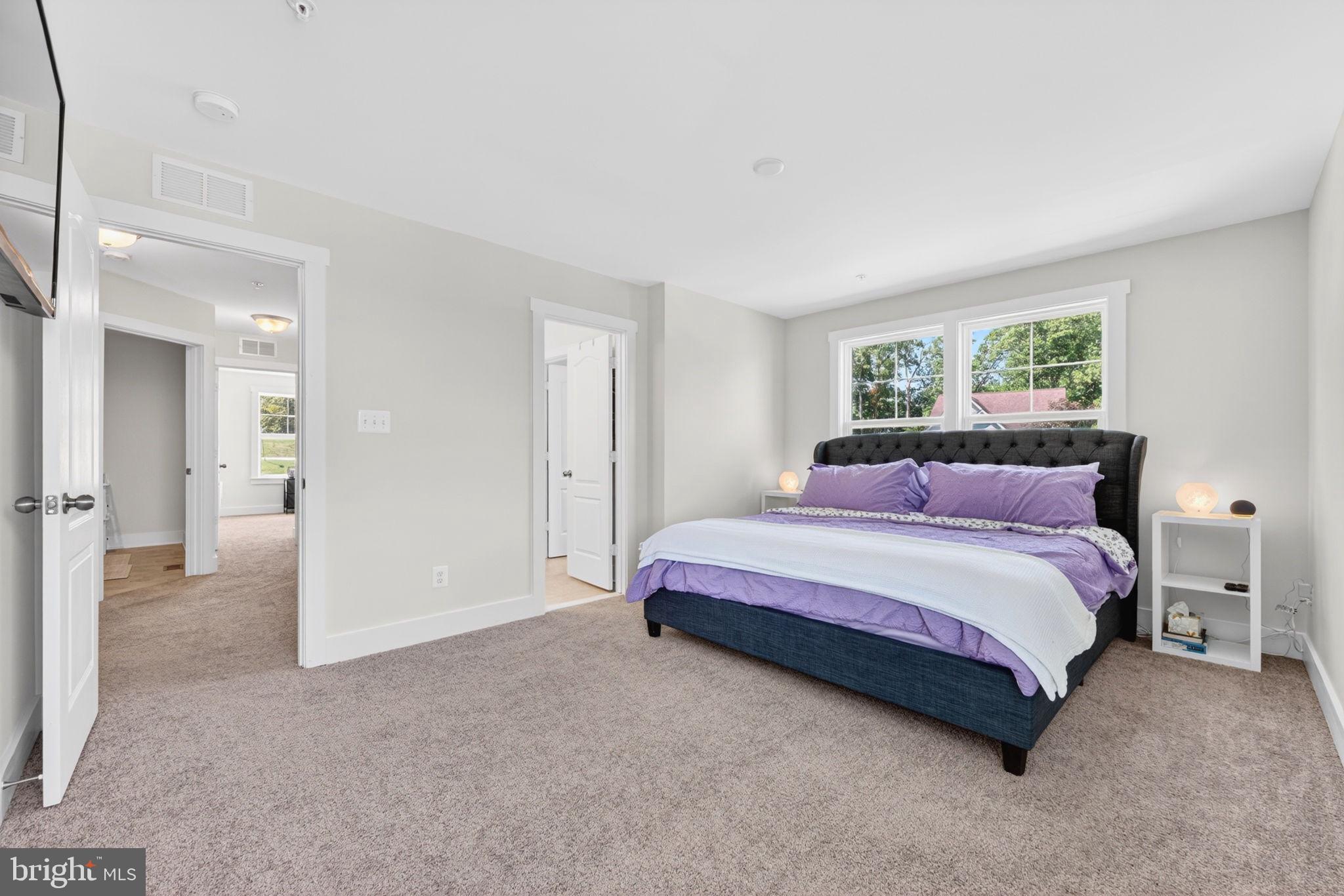 30 Range Road North East, MD 21901 - Photo 47 of 73 a spacious bedroom with a bed and a couch