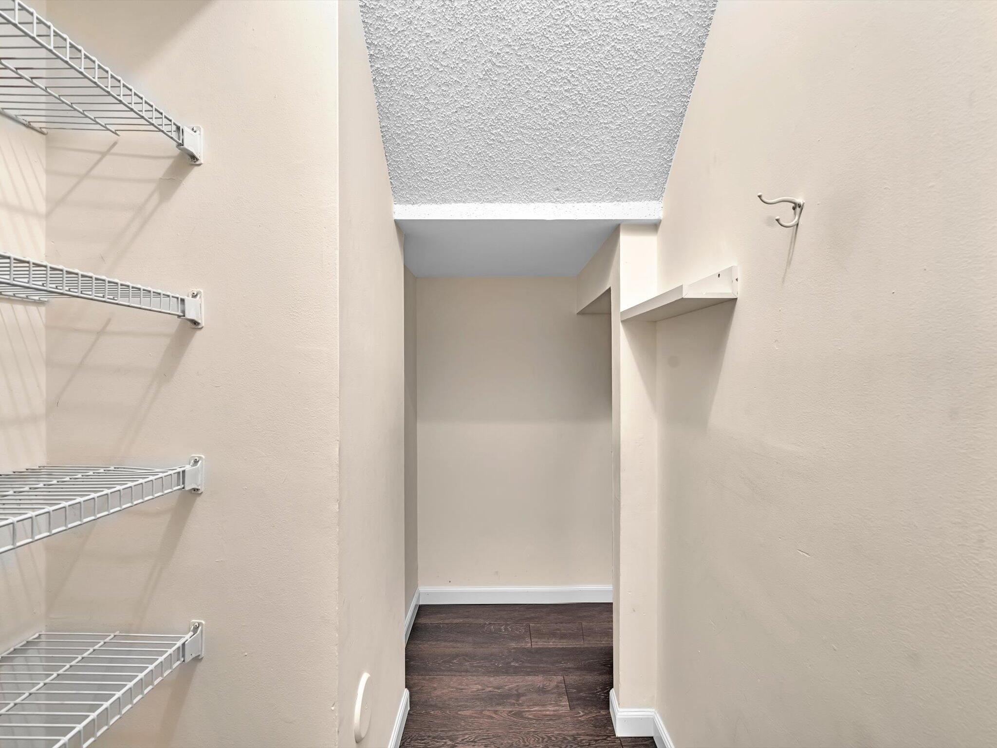 20930 Vía Azalea, Unit 5 Boca Raton, FL 33428 - Photo 17 of 37 Closet Under Stairs