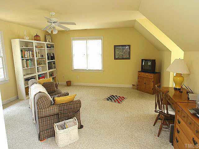 2628 Jasper Lane Raleigh, NC 27613 - Photo 5 of 8 a living room with furniture a air conditioner vent and a window