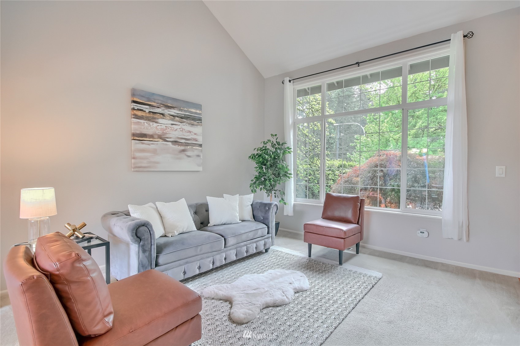 3007 204th Street Southeast Bothell, WA 98012 - Photo 11 of 37 a living room with furniture and a large window