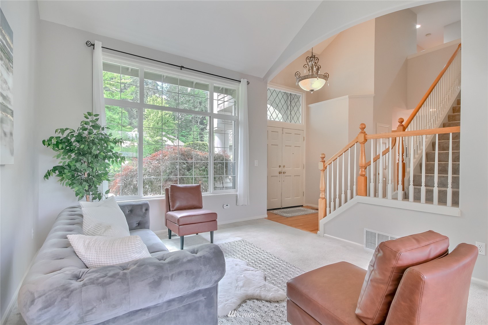 3007 204th Street Southeast Bothell, WA 98012 - Photo 12 of 37 a living room with furniture and a large window