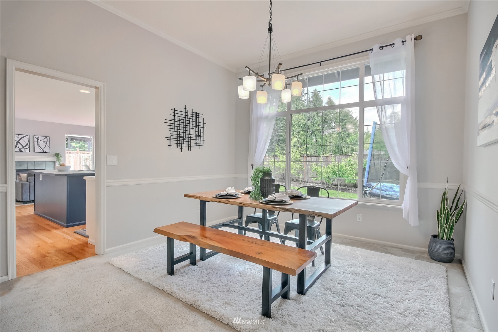 3007 204th Street Southeast Bothell, WA 98012 - Photo 14 of 37 a living room with furniture a window and a chandelier