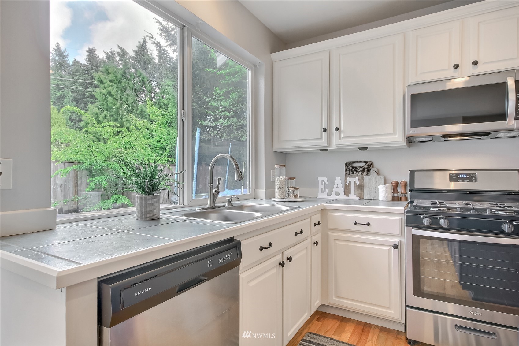 3007 204th Street Southeast Bothell, WA 98012 - Photo 16 of 37 a kitchen with a stove and a sink