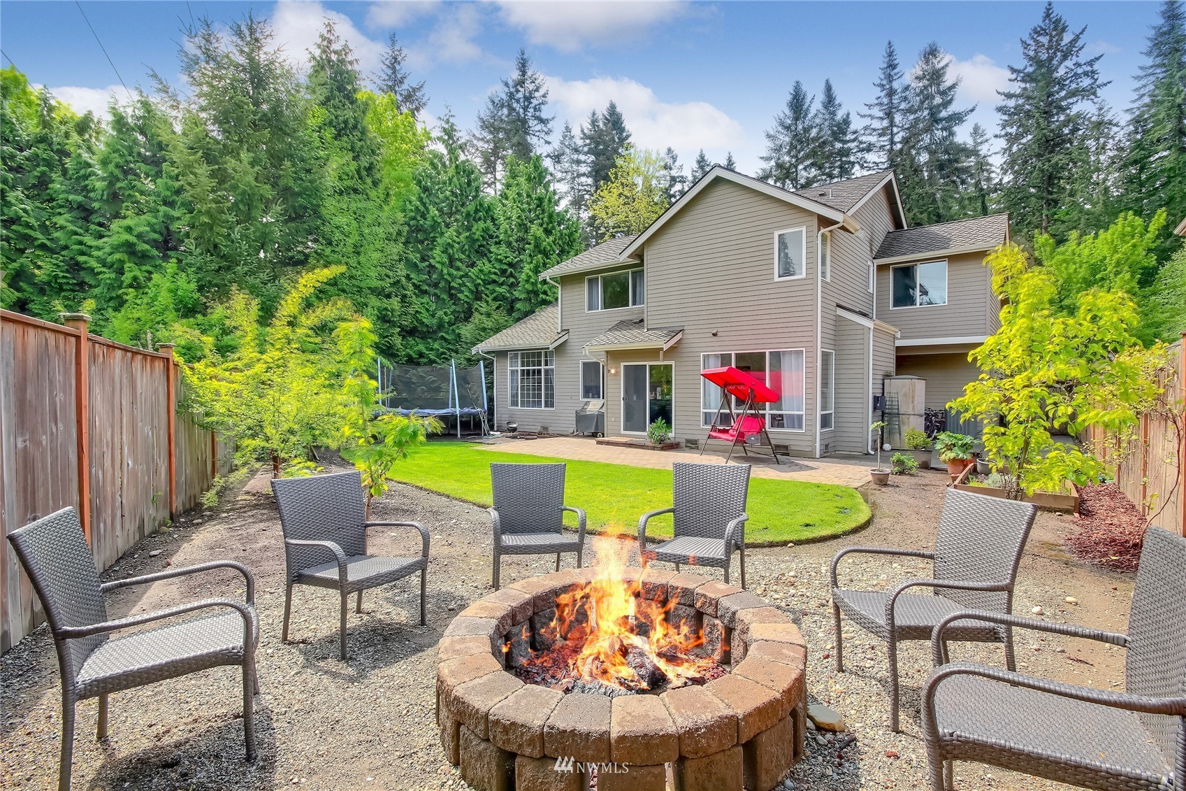 3007 204th Street Southeast Bothell, WA 98012 - Photo 2 of 37 a view of a patio with table and chairs and potted plants with wooden fence
