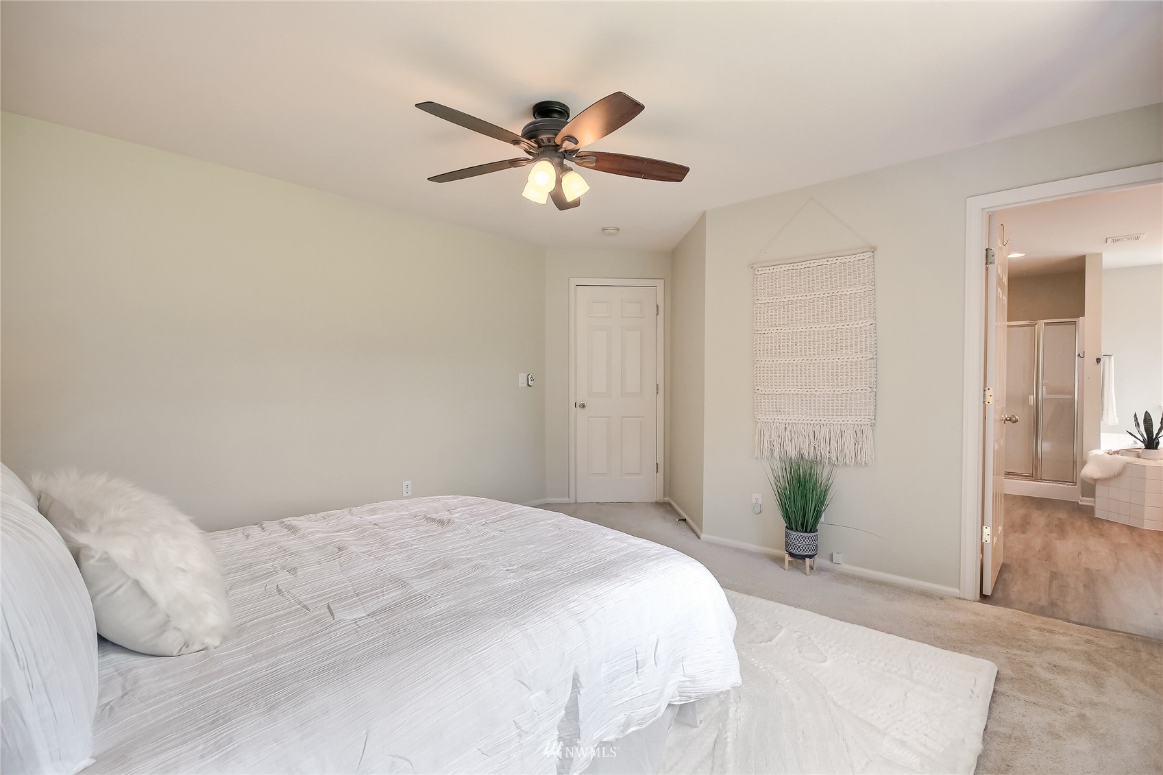 3007 204th Street Southeast Bothell, WA 98012 - Photo 23 of 37 a bedroom with a bed and ceiling fan