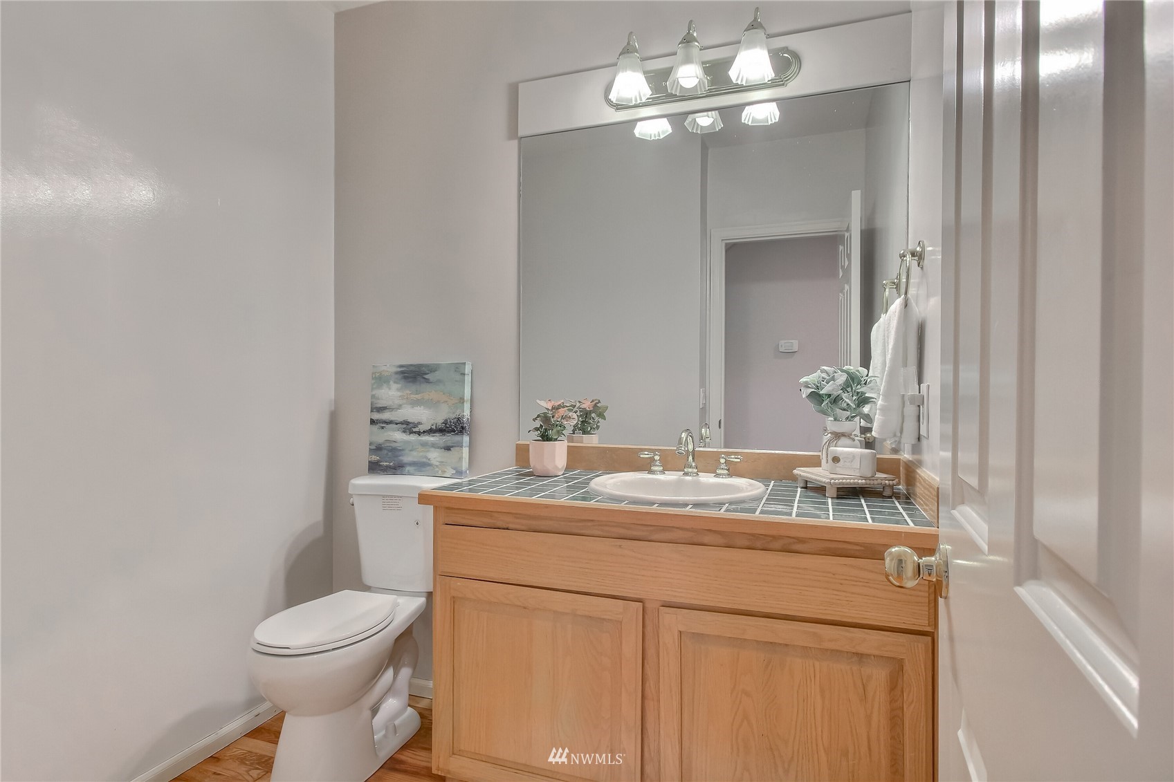 3007 204th Street Southeast Bothell, WA 98012 - Photo 30 of 37 a bathroom with a sink toilet and a mirror