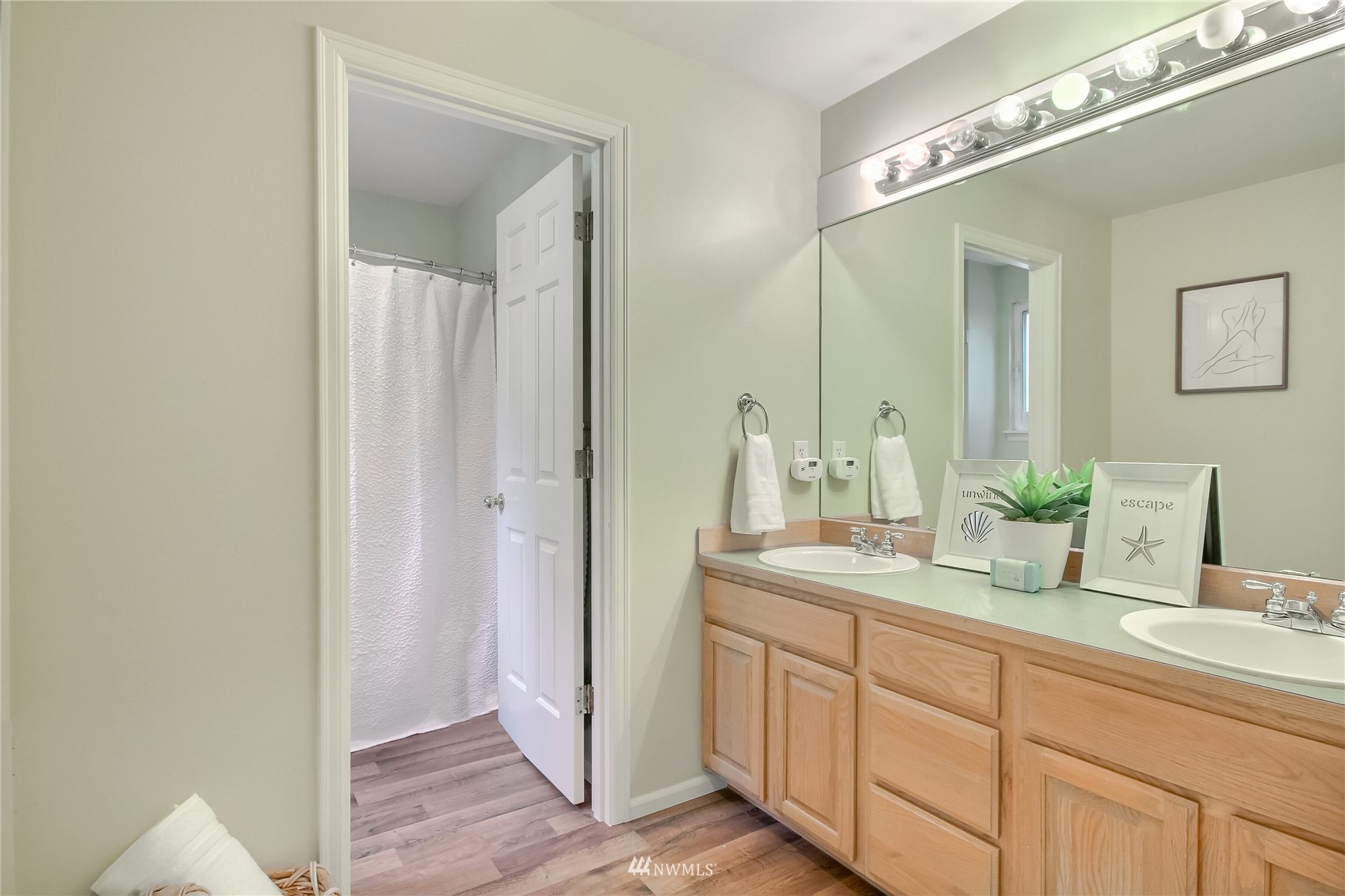 3007 204th Street Southeast Bothell, WA 98012 - Photo 31 of 37 a bathroom with a double vanity sink and a mirror