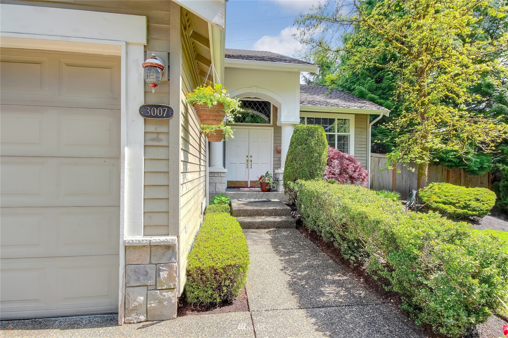 3007 204th Street Southeast Bothell, WA 98012 - Photo 4 of 37 a front view of a house with garden