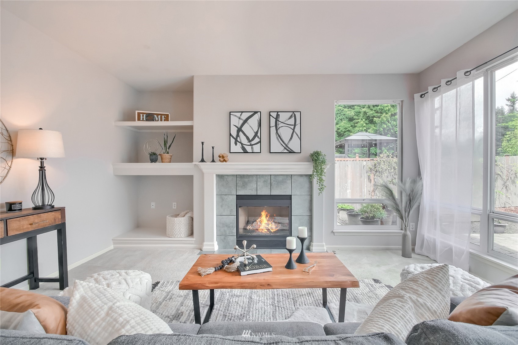 3007 204th Street Southeast Bothell, WA 98012 - Photo 7 of 37 a living room with furniture and a fireplace
