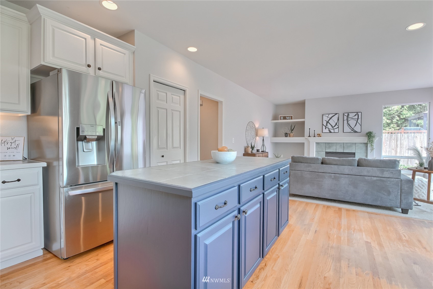 3007 204th Street Southeast Bothell, WA 98012 - Photo 8 of 37 a large kitchen with kitchen island a sink stainless steel appliances and cabinets