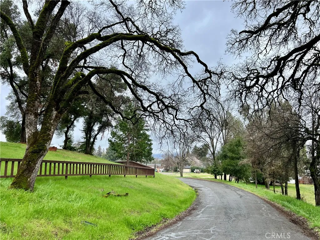 6590 Hotel Lucerne, CA 95458 - Photo 2 of 9 a view of a swimming pool with a bench and trees