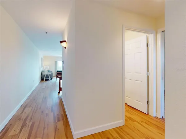 a view of a room with wooden floor