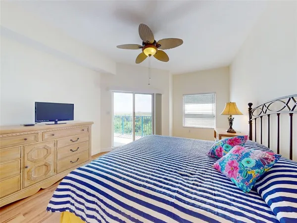 a bedroom with a bed and dresser