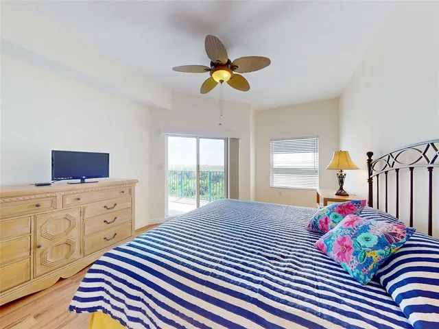 a bedroom with a bed and dresser