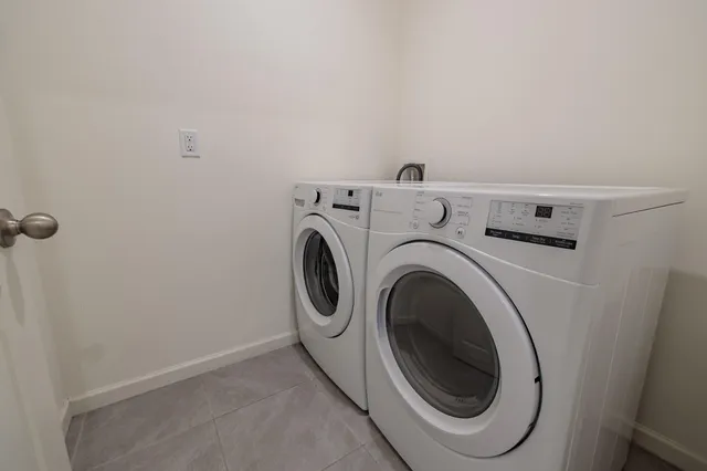 a utility room with dryer and washer
