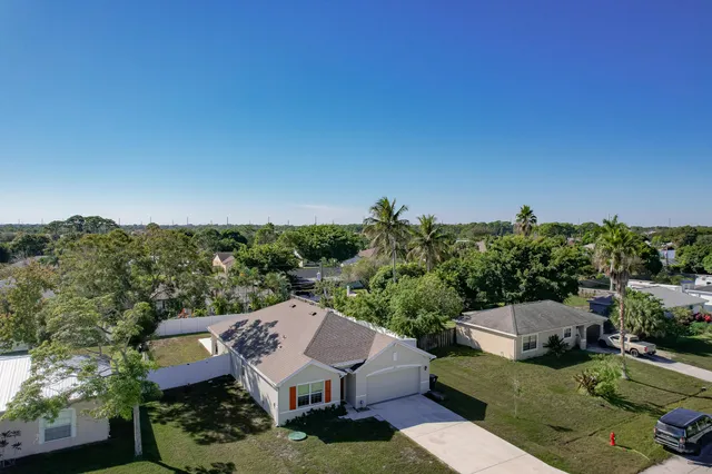 an aerial view of a house with a garden
