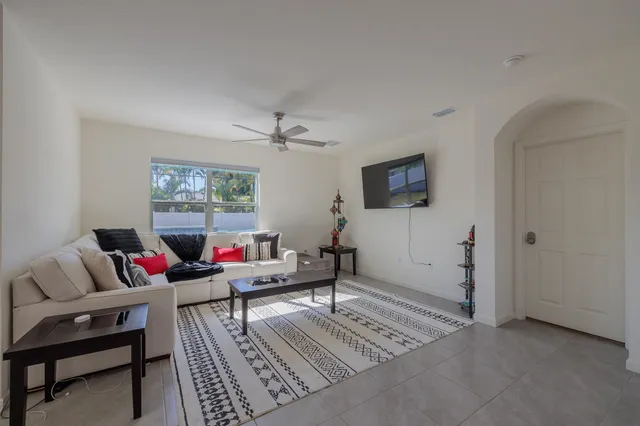 a living room with furniture and a rug
