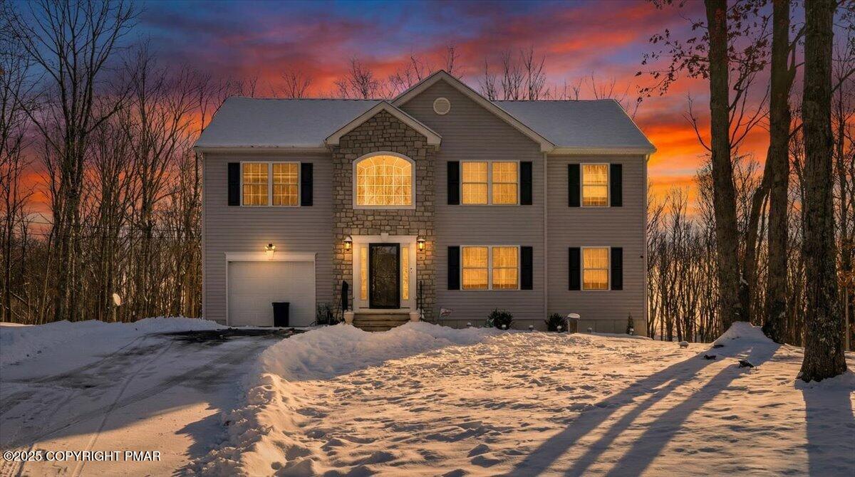 a front view of a house with a yard