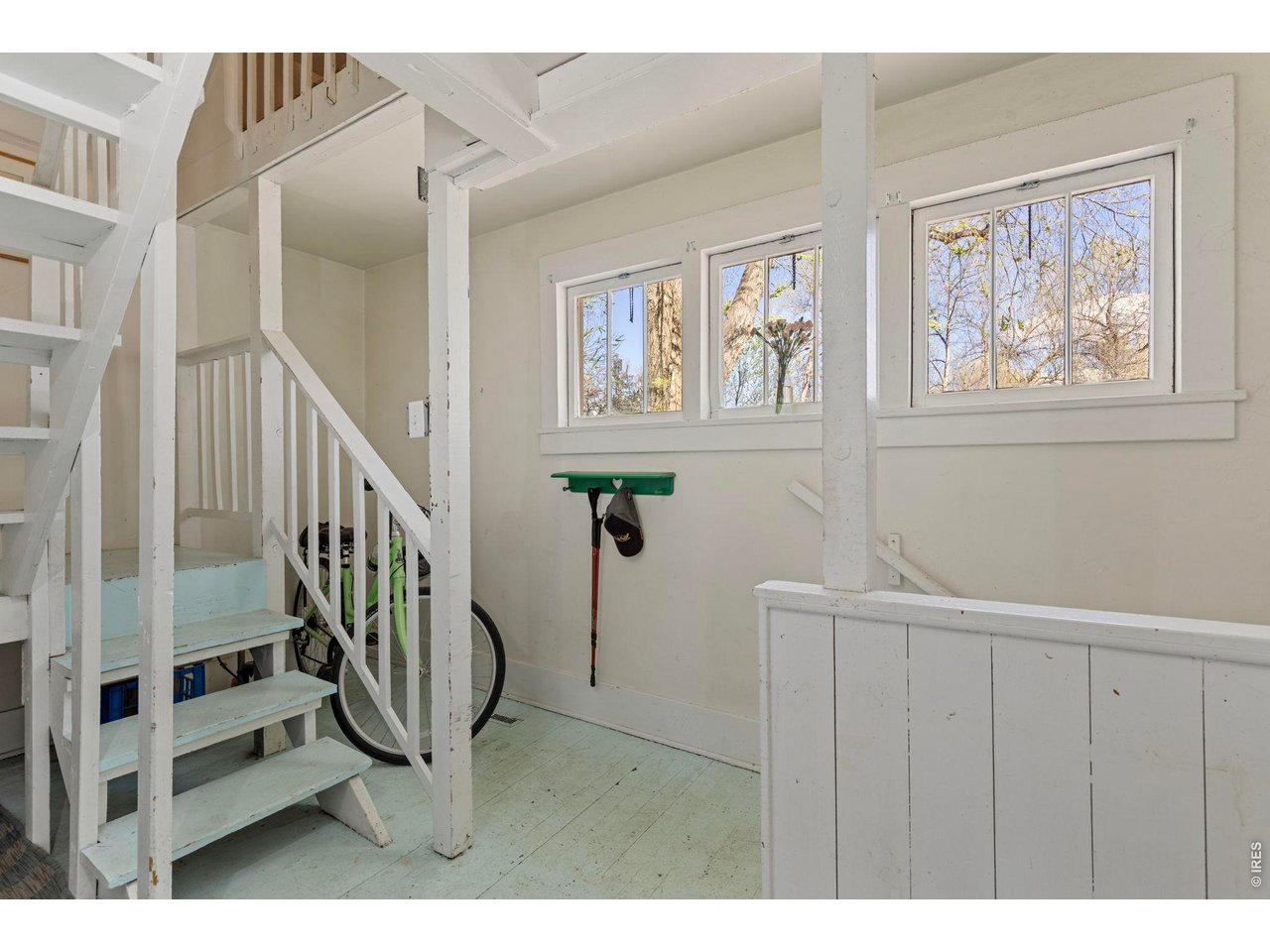 206 South Shields Street Fort Collins, CO 80521 - Photo 15 of 47 a view of staircase with lots of frames on wall and a window