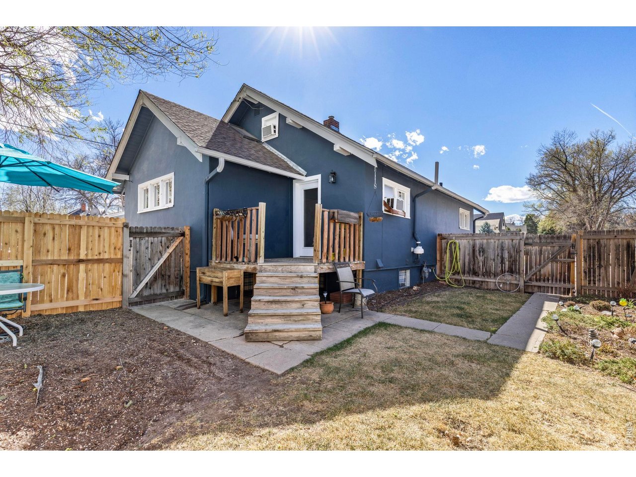 206 South Shields Street Fort Collins, CO 80521 - Photo 26 of 47 a view of a house with a patio and a yard