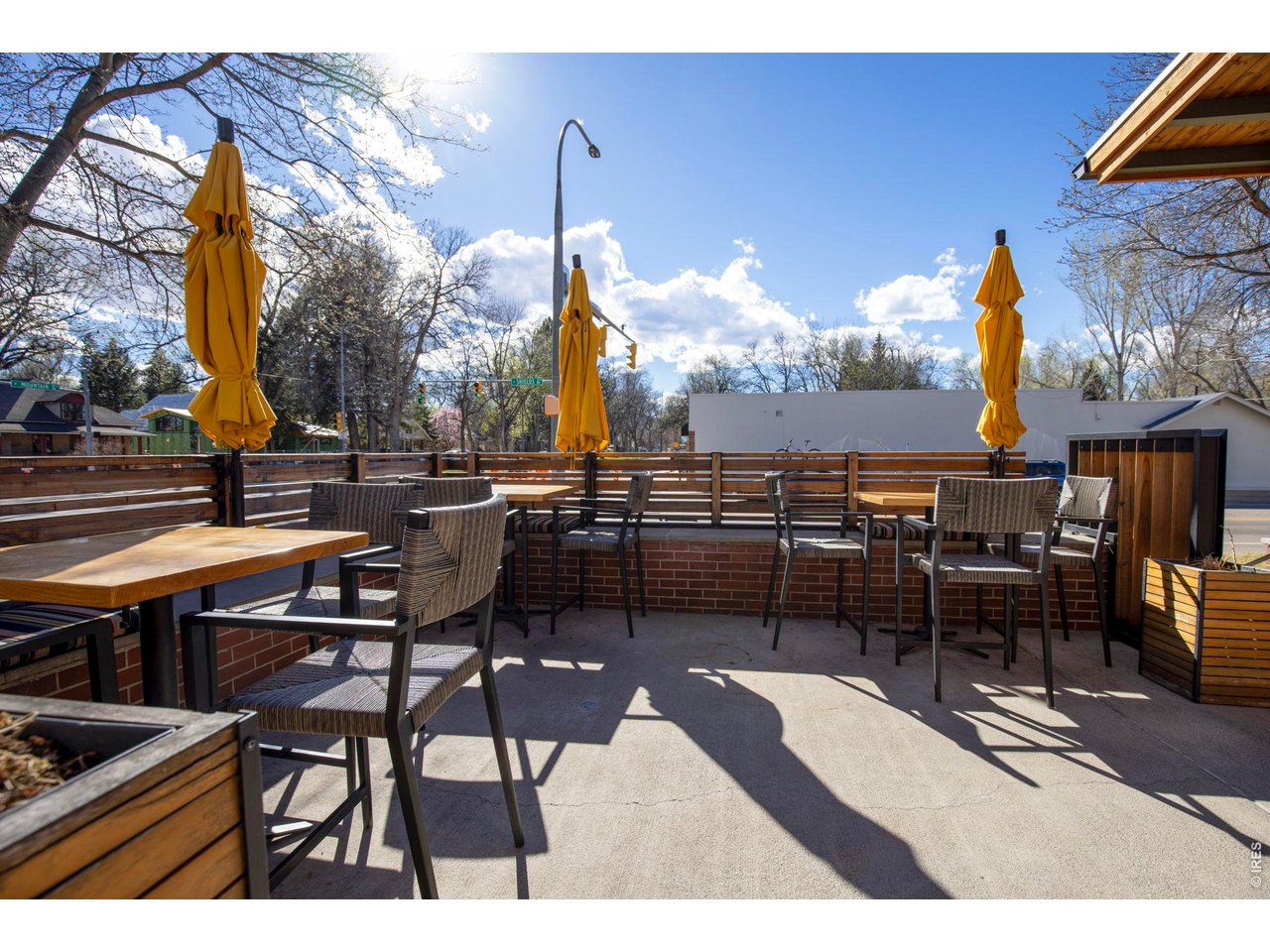 206 South Shields Street Fort Collins, CO 80521 - Photo 36 of 47 a view of a tables and chairs in patio