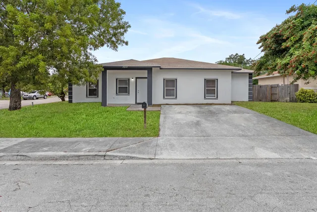 front view of a house with a yard