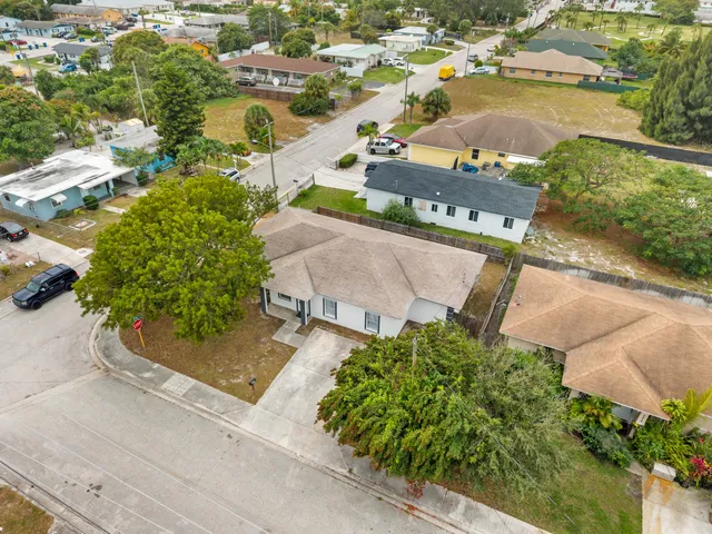 an aerial view of a house with a lake view