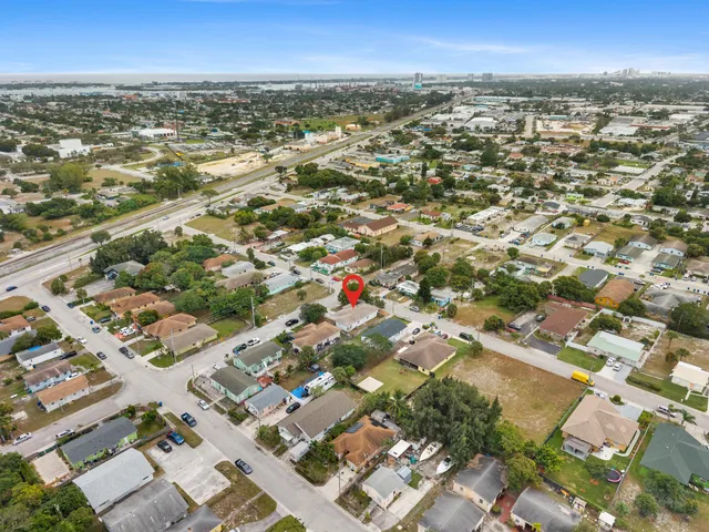 an aerial view of residential building with parking