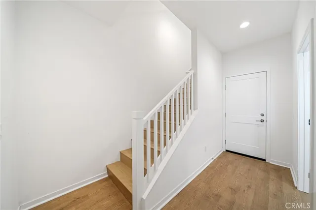 a view of a hallway with staircase