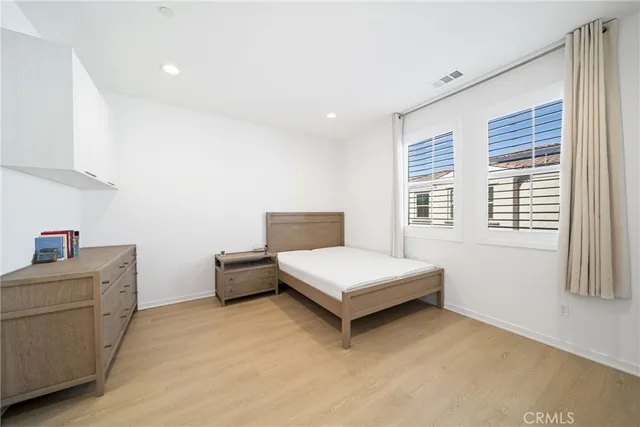 a room with a bed and a window