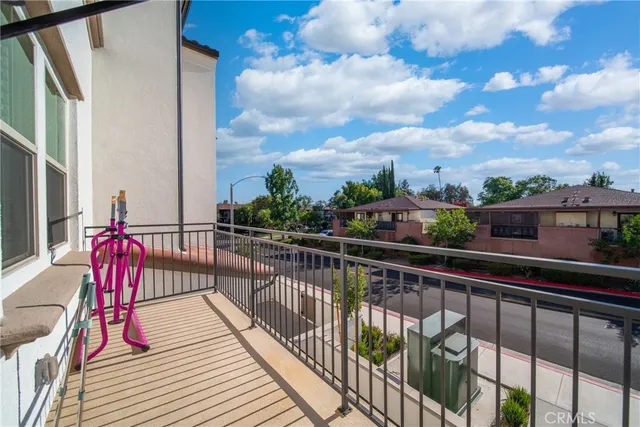 a view of a balcony with wooden floor