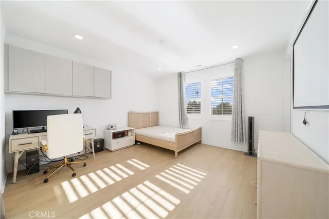 a bedroom with furniture and a window