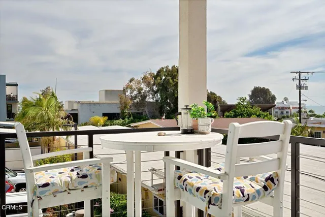a view of an outside dining space with furniture