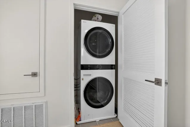 a close view of a utility room with dryer and washer