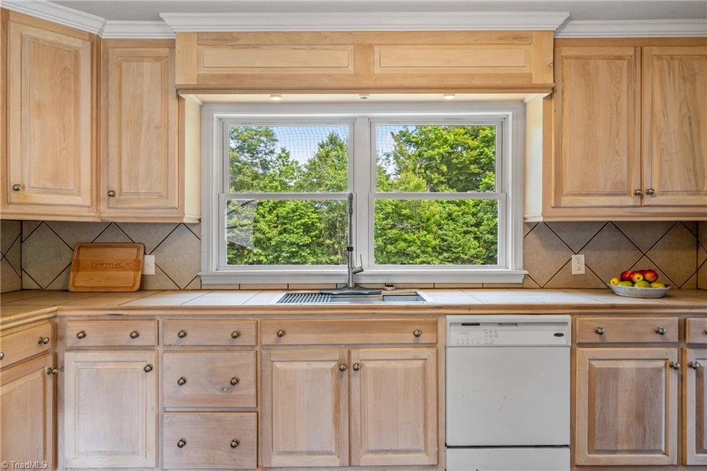 753 Wolf Island Road Reidsville, NC 27320 - Photo 12 of 42 Double windows over sink offer view of backyard